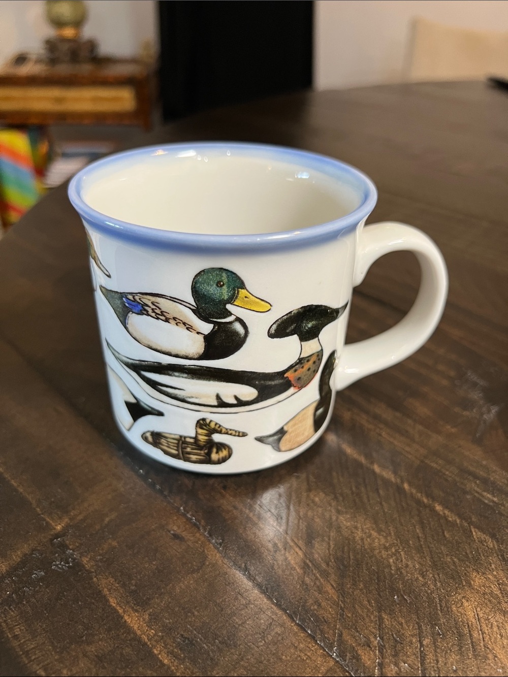 Stanley Papel White Ceramic Mug with Blue Rim and Multicolored Duck Motif